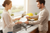 Couple at marble kitchen sink